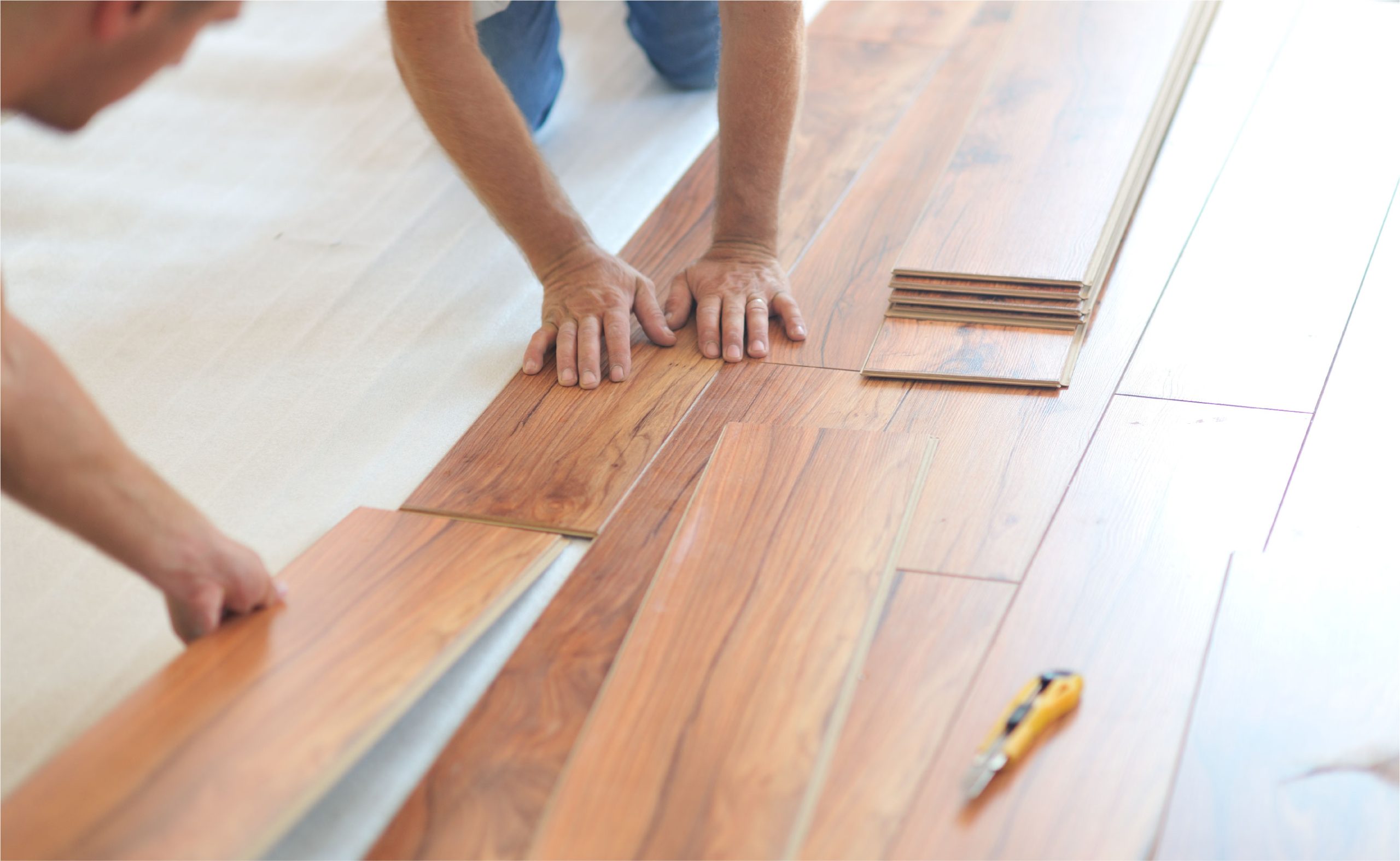 handymen installing wood floor